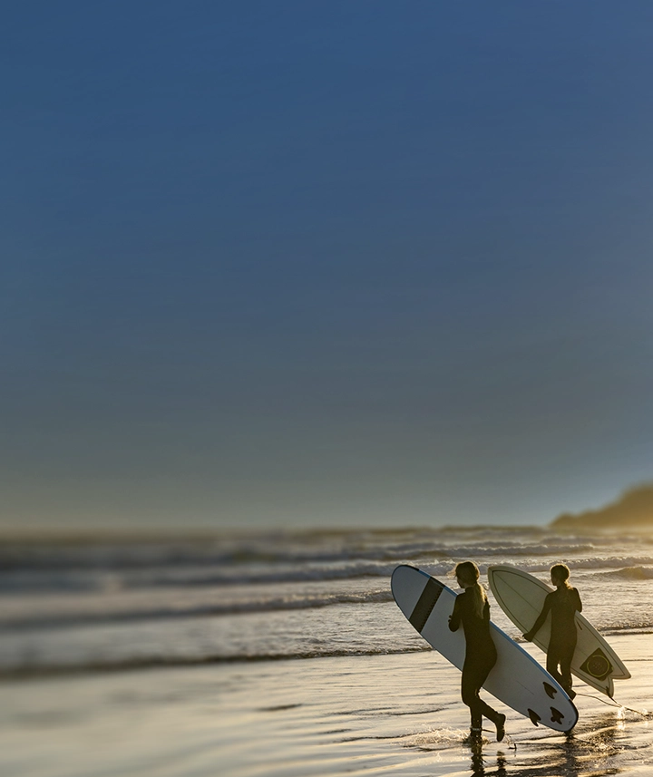 two friends surfing in Tofino